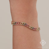 14k gold Cuban chain bracelet with genuine rainbow sapphires