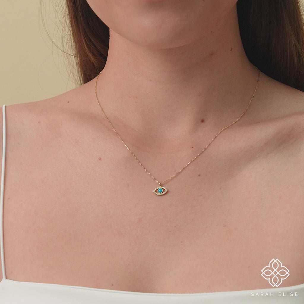 Protective evil eye necklace with turquoise and diamonds in 14k gold