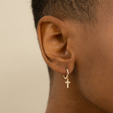 Model wears Gold Cross Earrings with Diamonds in solid gold