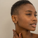 Model wears Minimalist Gold Butterfly stud Earrings