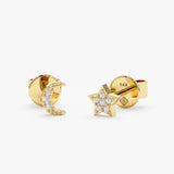 handmade pair of solid 14k gold moon and star stud earrings with diamonds