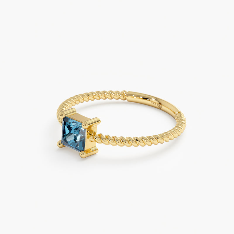 Solid Gold Prong Set Blue Topaz Ring
