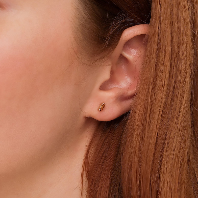 model wears minimalistic citrine baguette stud in 14k solid Gold