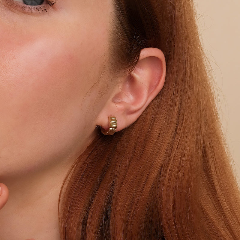 Model wears handmade ethically sourced minimalist grosgrain huggie earring