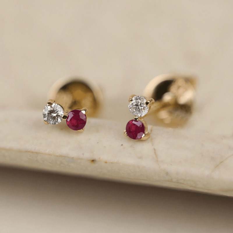 Dainty pair of solid 14k solid gold ruby stud earrings with single diamond