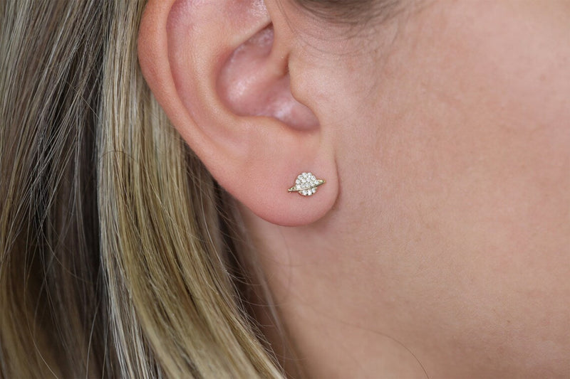 minimalistic astrology earrings in saturn shape with diamonds
